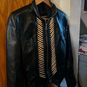 Leather motorcycle jacket with bone detail. Super warm. Perfect condition.